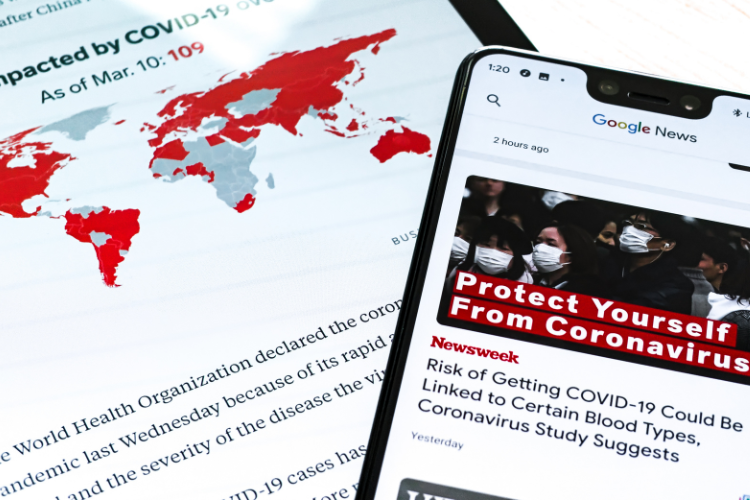 Tablet and phone screens displaying Covid-related news items from the beginning of the pandemic