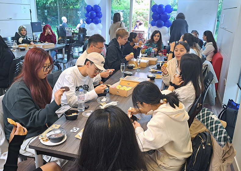 A table of IFP students enjoying their free lunch