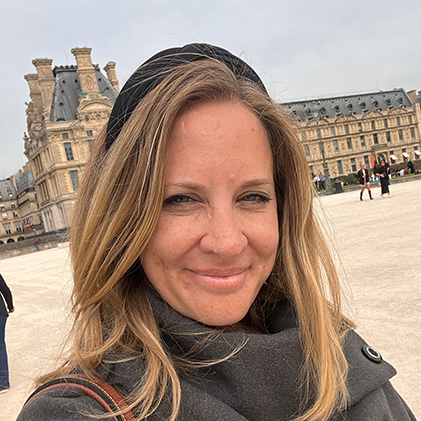 Andrea Wadham stood outside the Louvre in Paris