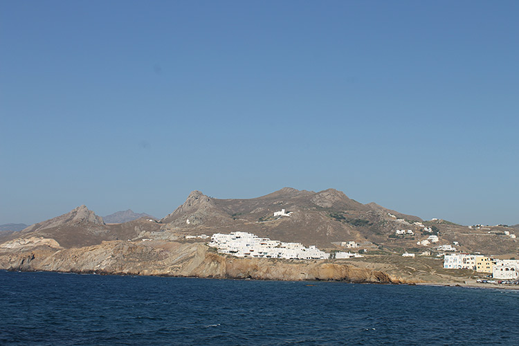 sea with hilly island in the background. 