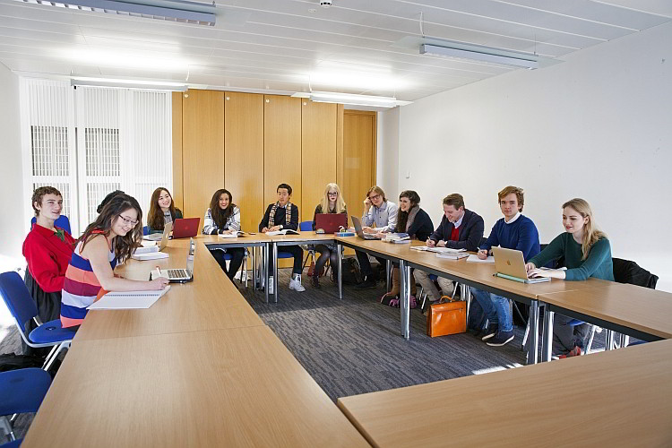 Students sitting at their desks during a seminar at St Andrews.