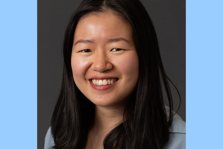 Janis Wong, smiling in a close-up headshot