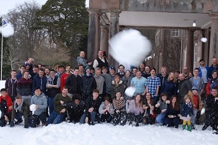 Students throwing snowballs at the photographer.