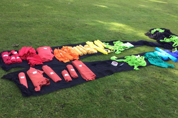 Rolled up coloured bands for the Neon spectrum on the lawn.