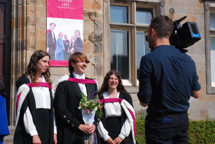 Graduates being interviewed.