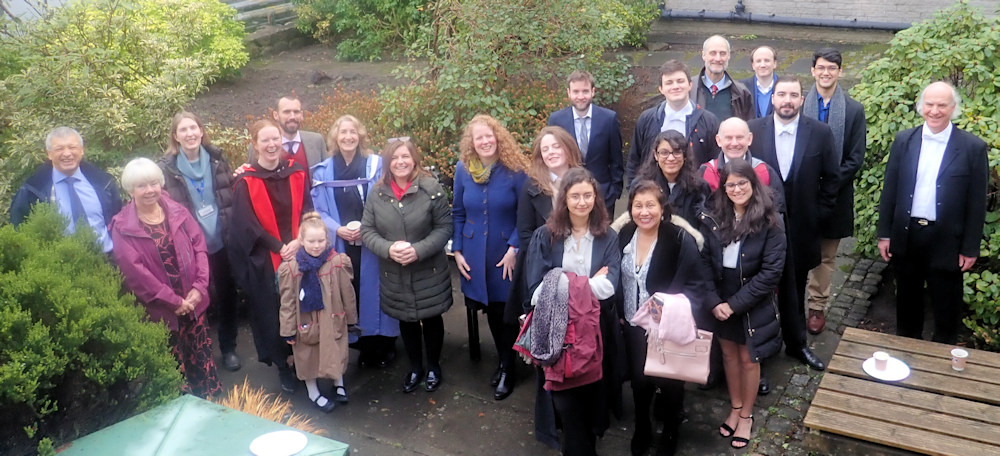 Graduates and staff at informal meeting.