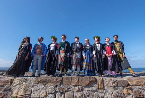 A diverse mix of students standing on the pier