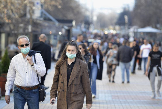 people with facemasks on in street