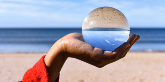 hand holding crystal ball