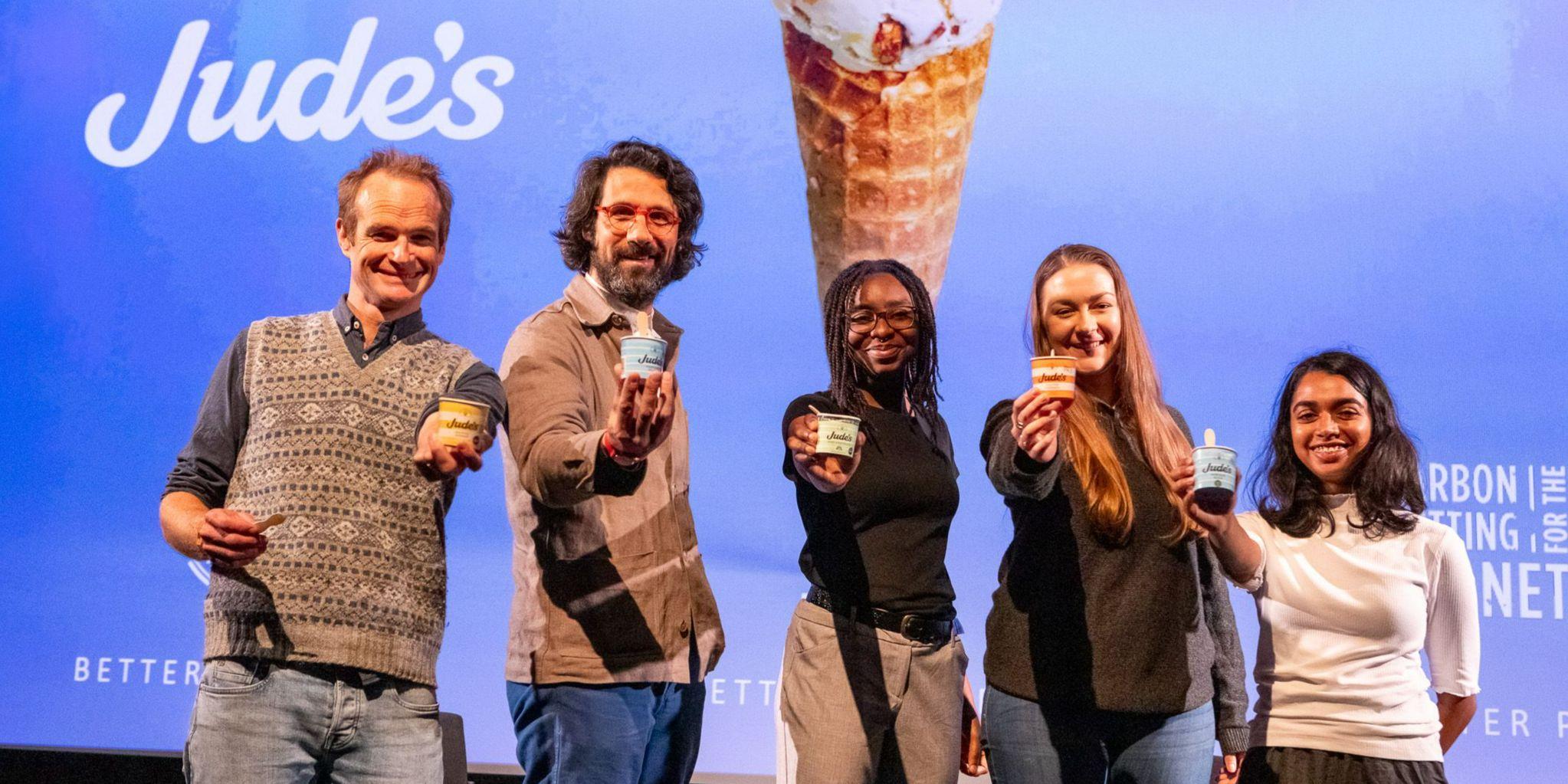 Five people holding tubs of ice cream