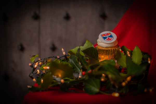 festive image with cupcake with university crest