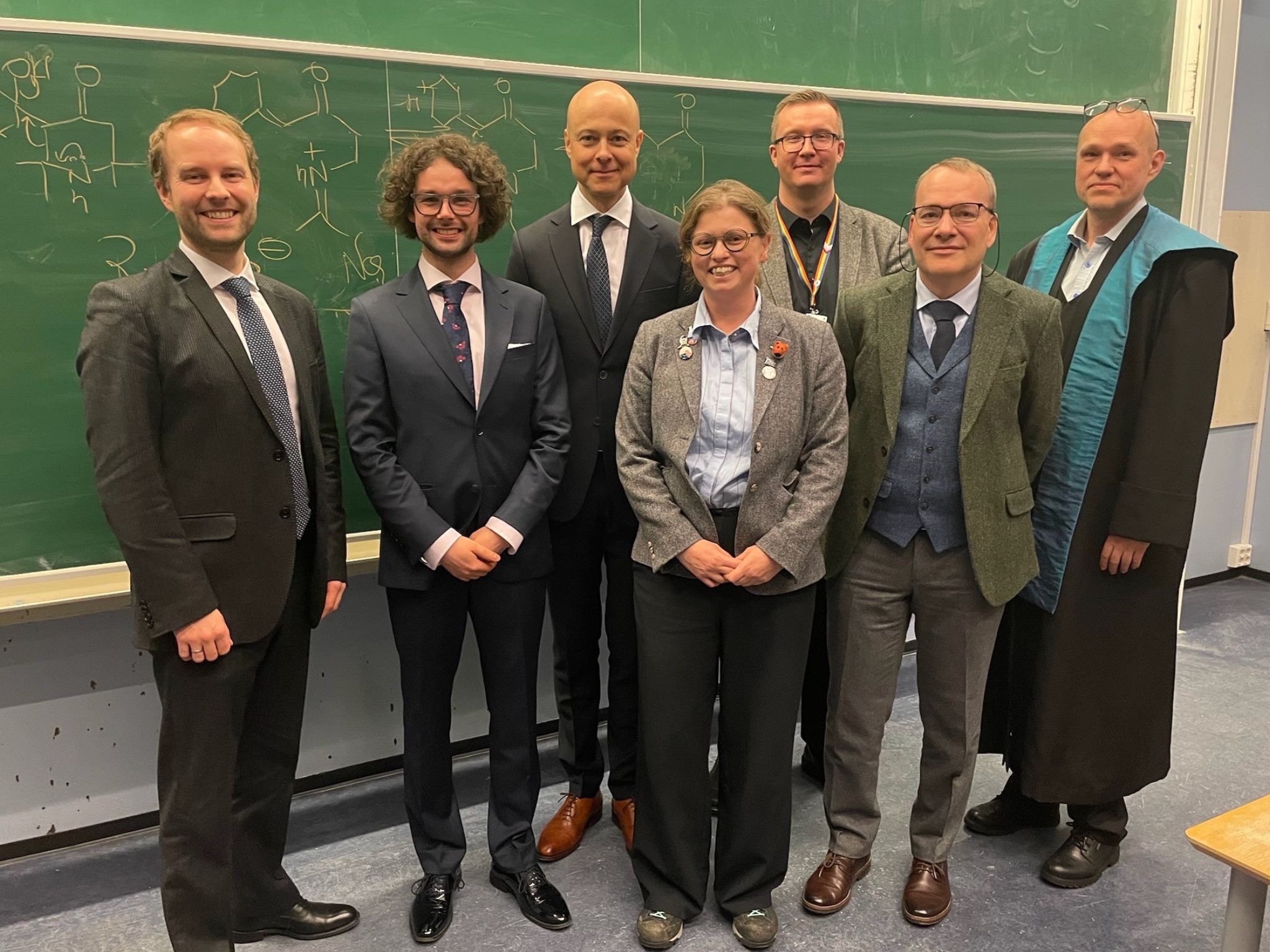 Group of people looking happy following the PhD viva of Mateusz Sowinski.
