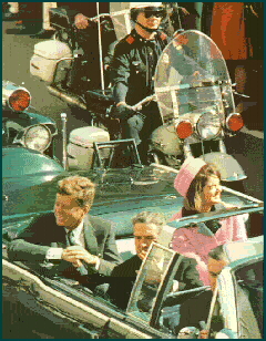 The Presidential car in 
Dealey Plaza, moments before the shooting